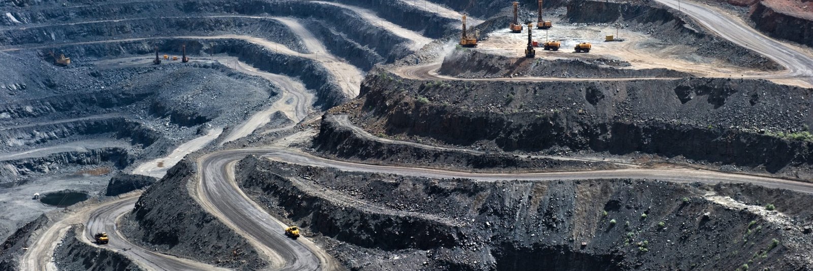 high-angle-view-winding-roads-open-pit-mine high-angle-view-winding-roads-open-pit-mine